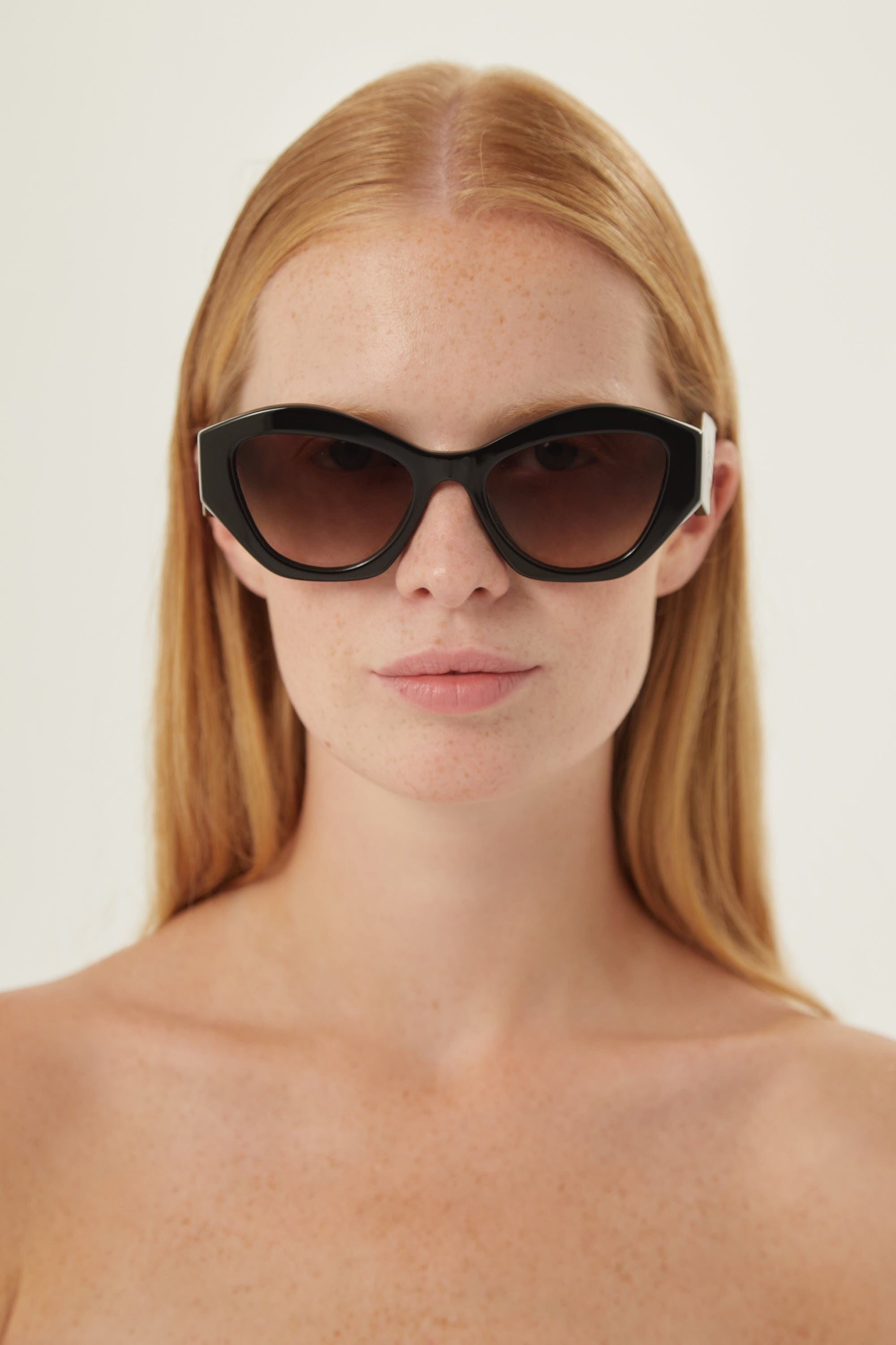 Prada oval black sunglasses featuring iconic logo