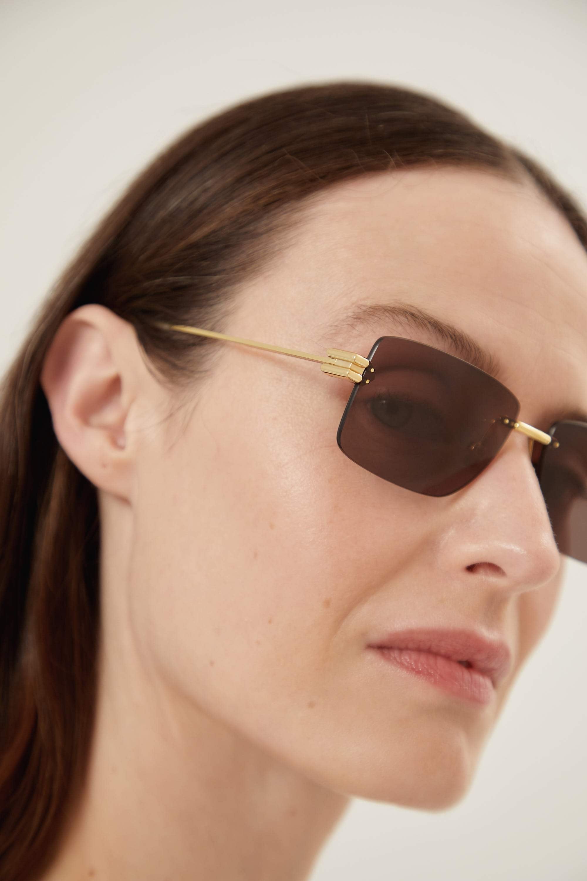 Bottega Veneta rimless brown and gold sunglasses