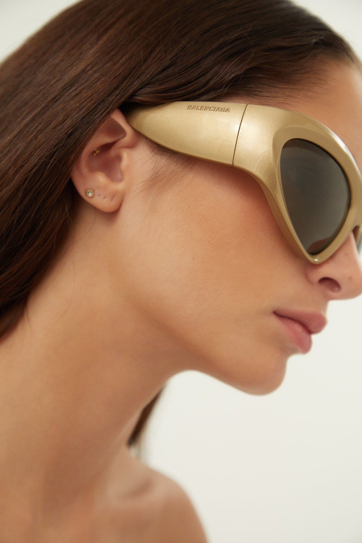 Balenciaga bold wrap around gold sunglasses