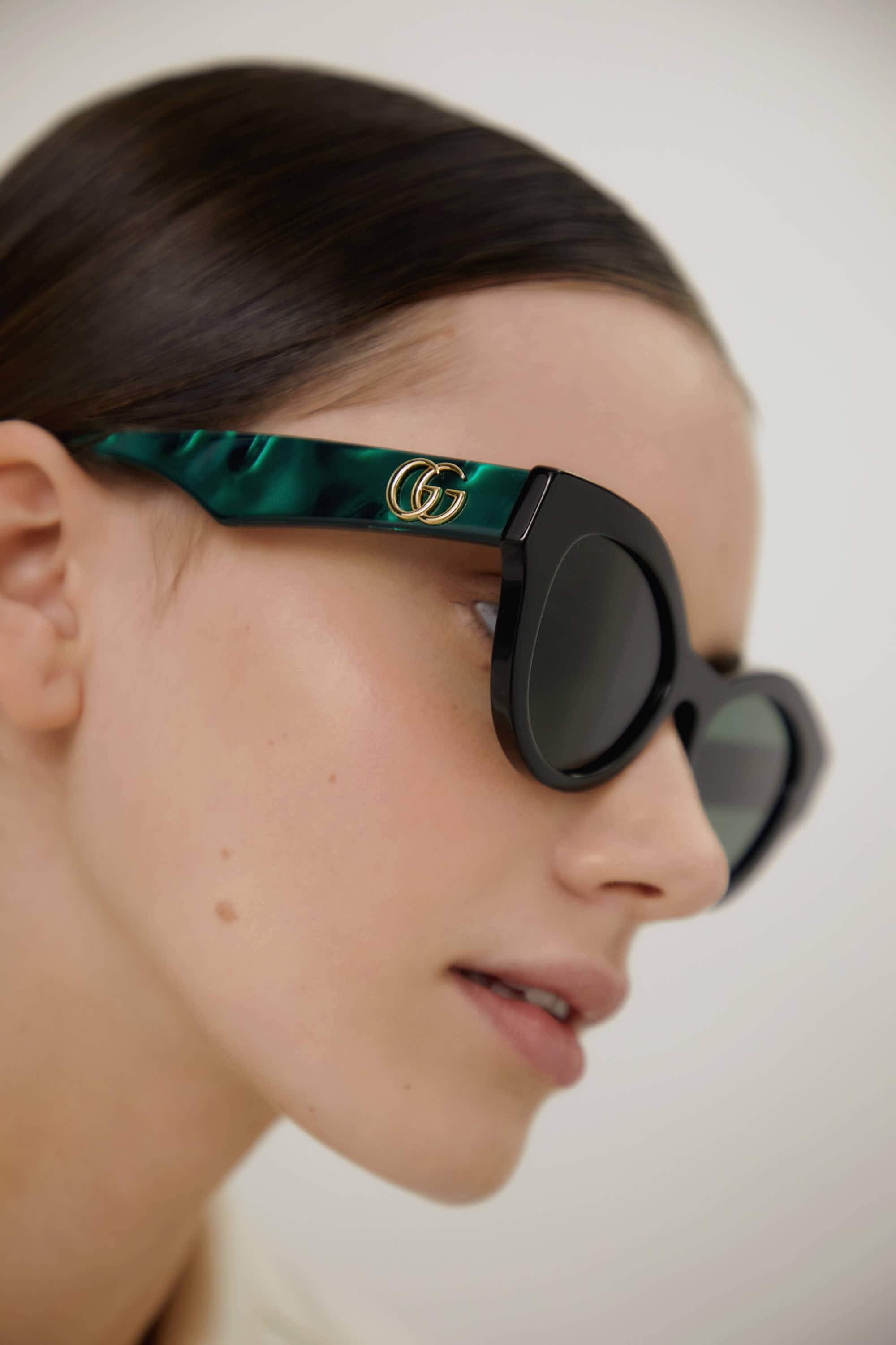 Gucci cat eye black and green sunglasses