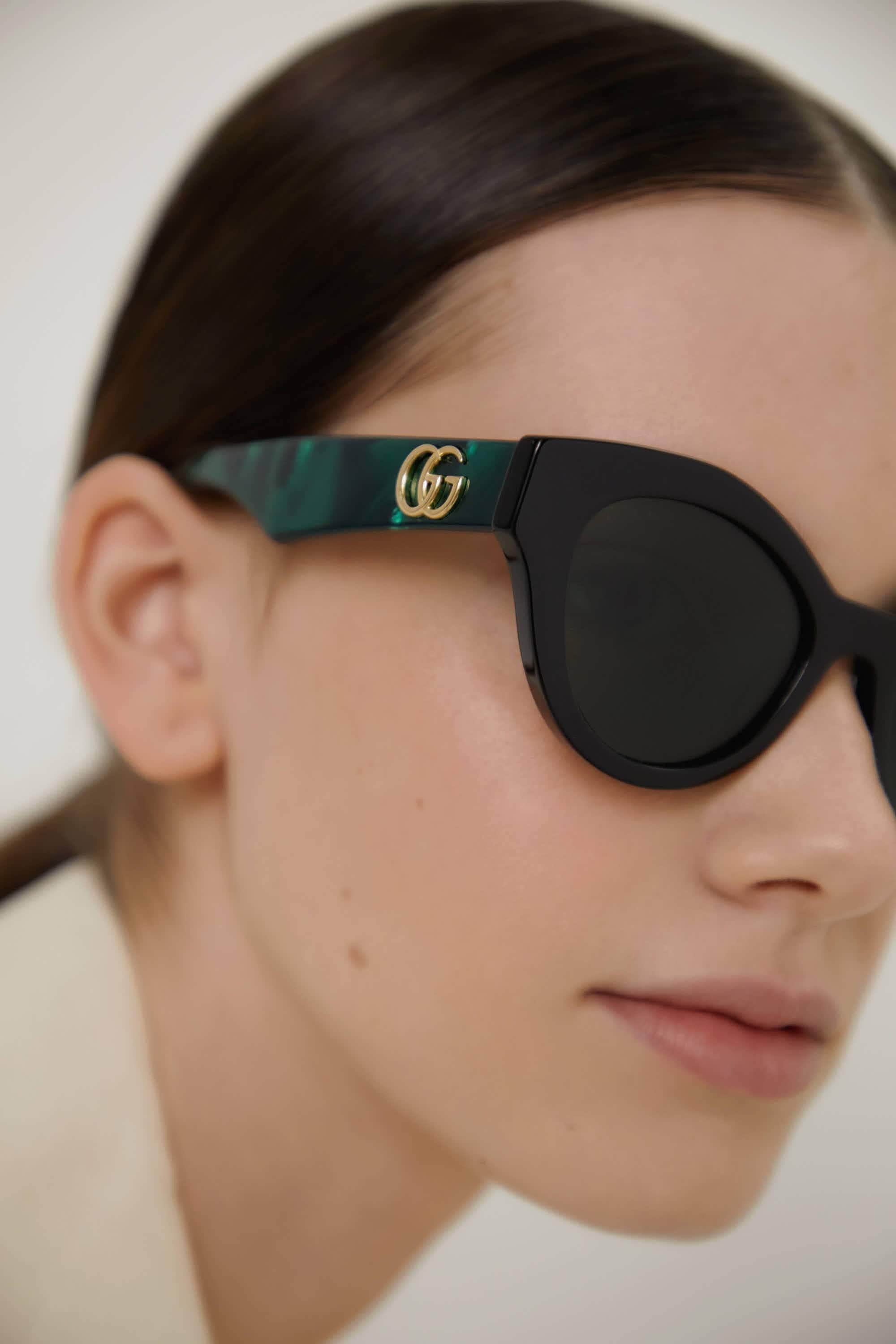 Gucci cat eye black and green sunglasses