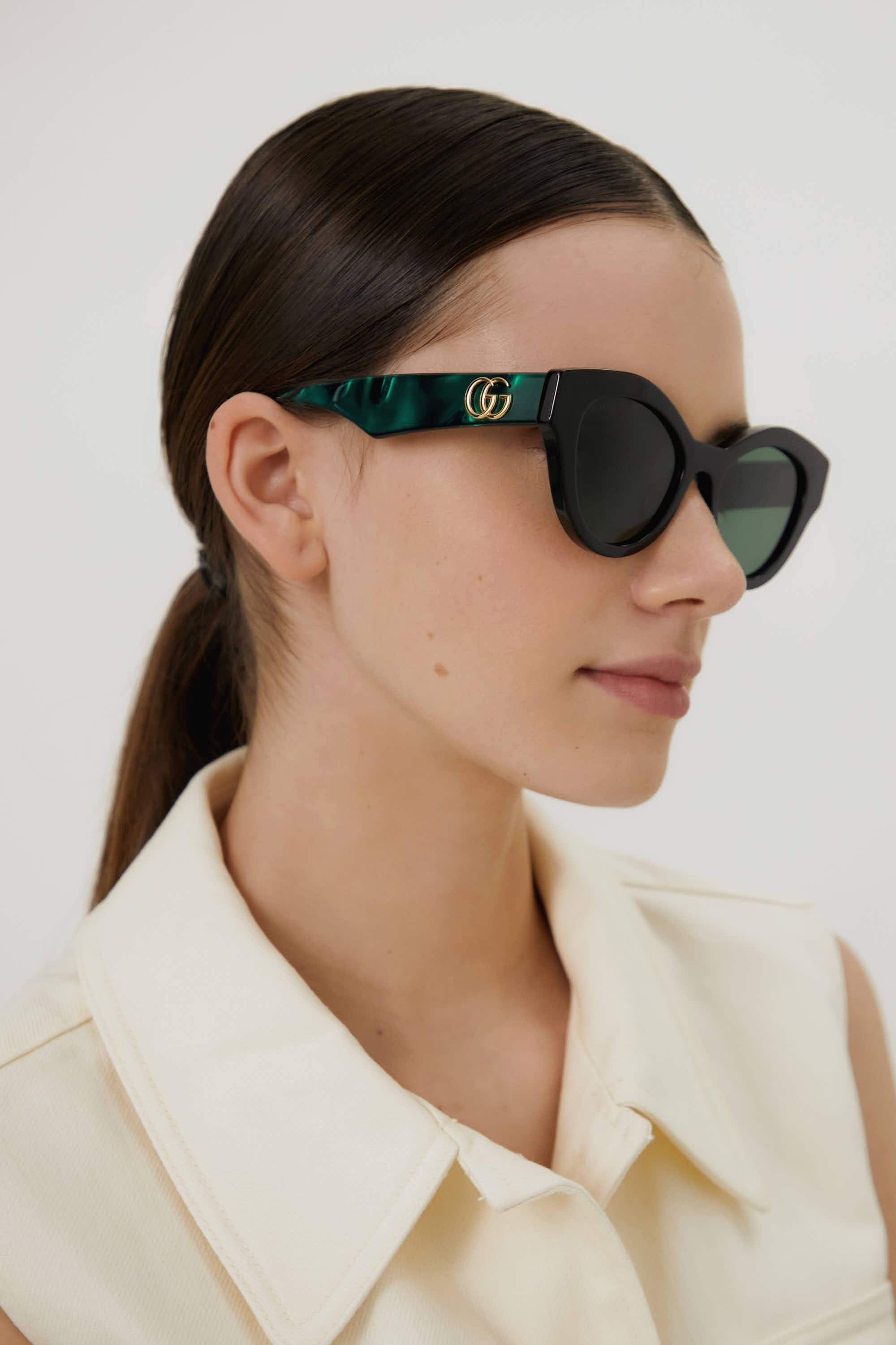 Gucci cat eye black and green sunglasses