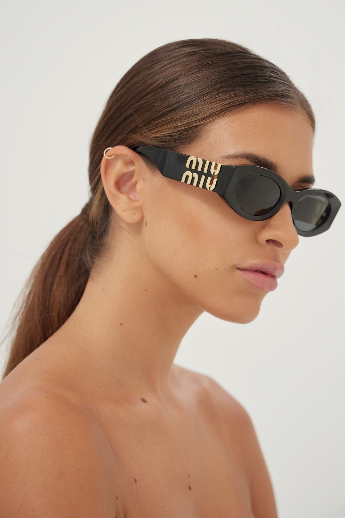 Miu Miu small oval black sunglasses