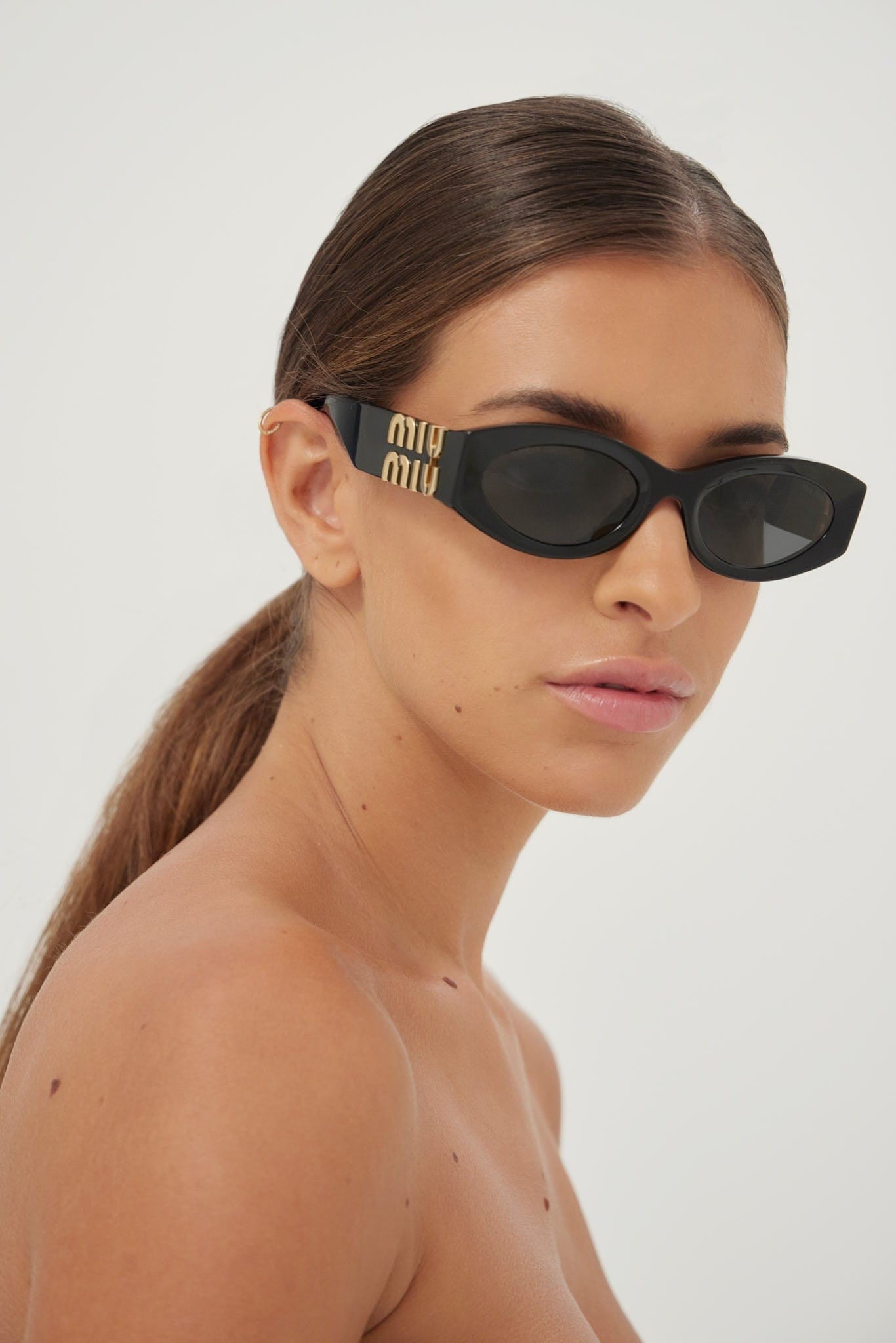 Miu Miu small oval black sunglasses